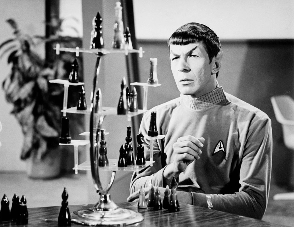 Leonard Nimoy in his role as Mr. Spock, the logical, pointed-eared First Officer from the planet Vulcan of the starship Enterprise, on the TV series "Star Trek", in a publicity shot. The thing in front of him is a 3-d chess game.