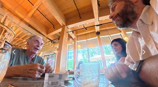 Michael Freeman having coffee with Adam Juniper and Ariane Sherine