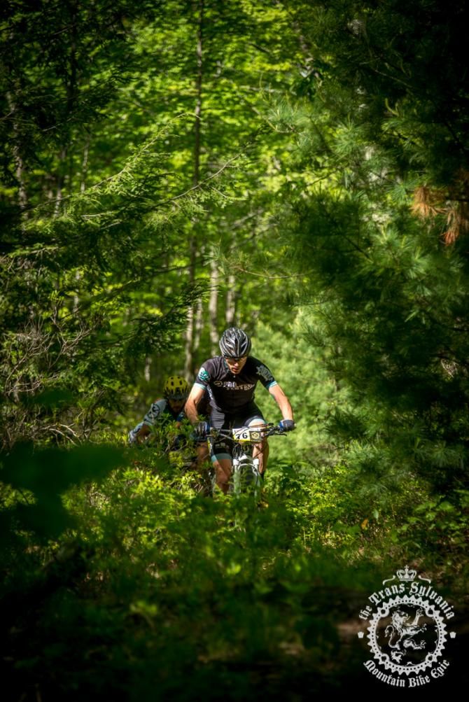 Nick Waite rolls through the green singletrack tra il in Stage 7