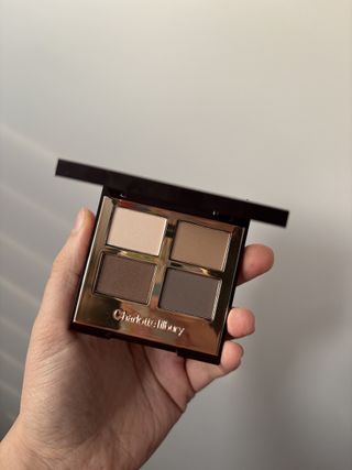 Mica Ricketts holding The Sophisticate Luxury Palette