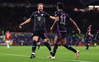 Harry Kane and Kingsley Coman celebrate Bayern's winning goal