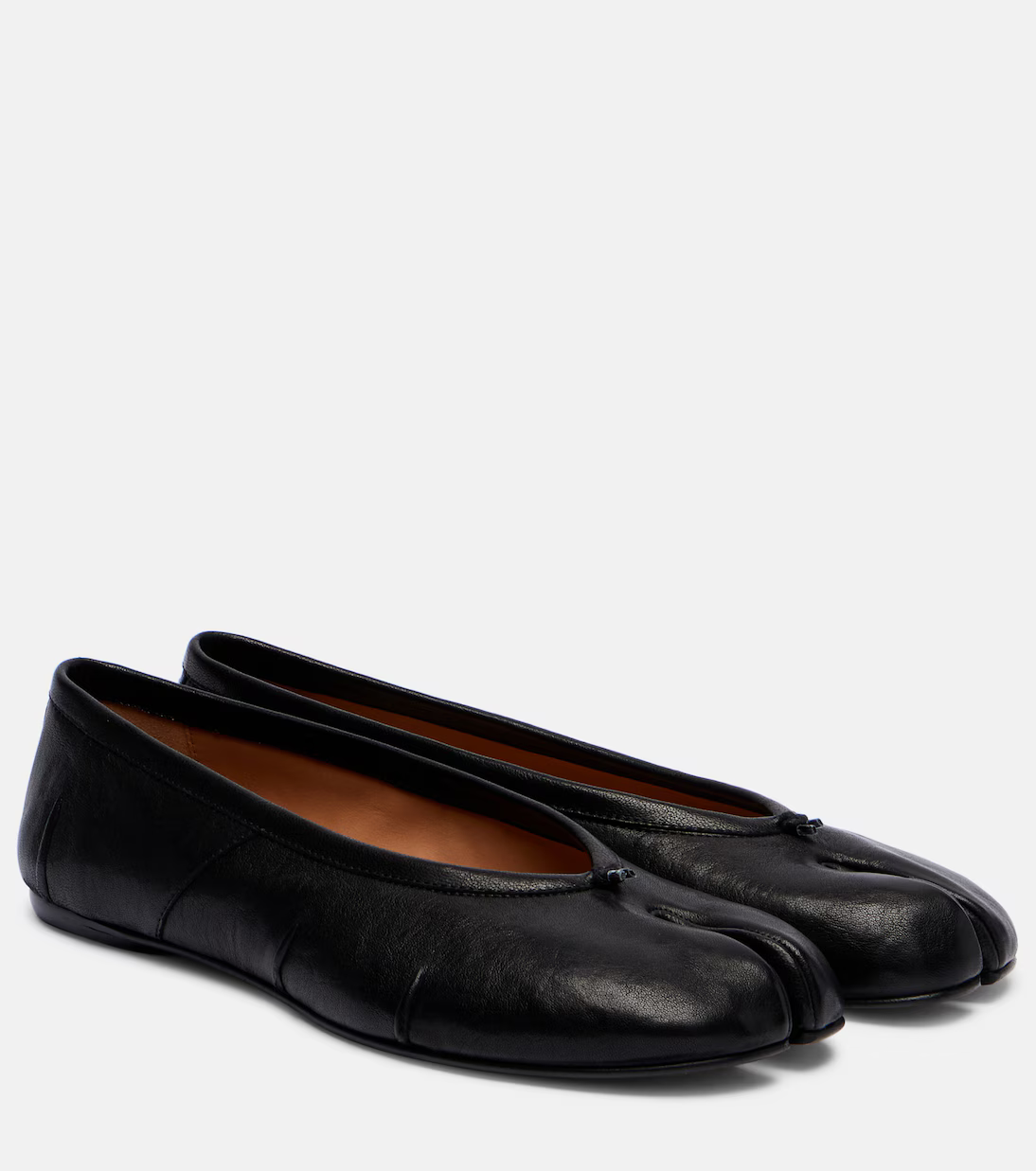 A pair of black Maison Margiela Tabi flats.