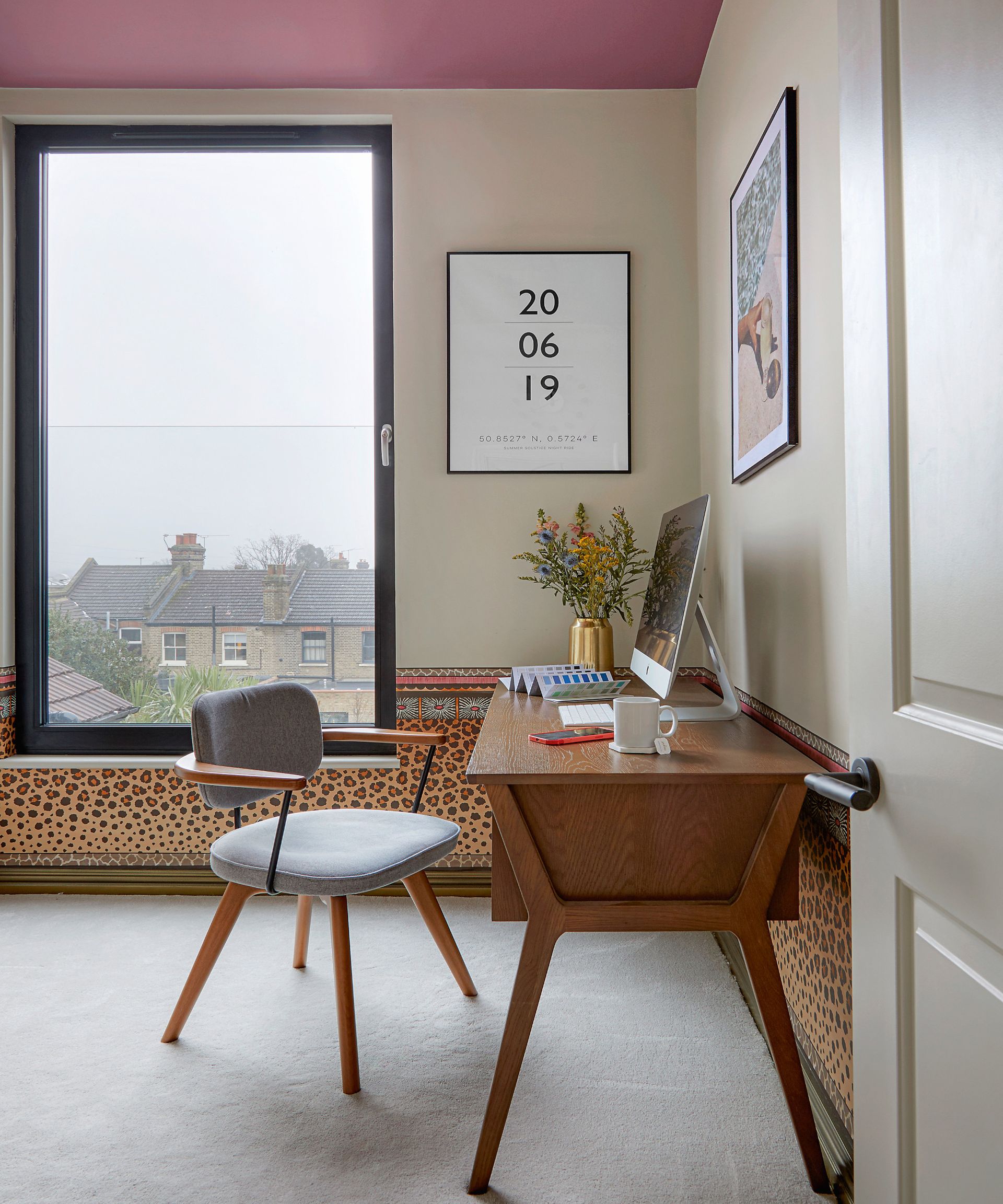 Loft room with feature wall ceiling in pink and desk