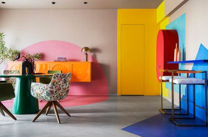 a colorful dining room with painted color blocks