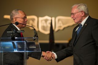 NASA Administrator Charles Bolden (left) and Jack Dailey, director of the Smithsonian's National Air and Space Museum, celebrate the NACA sign transfer to the museum in March 2015.