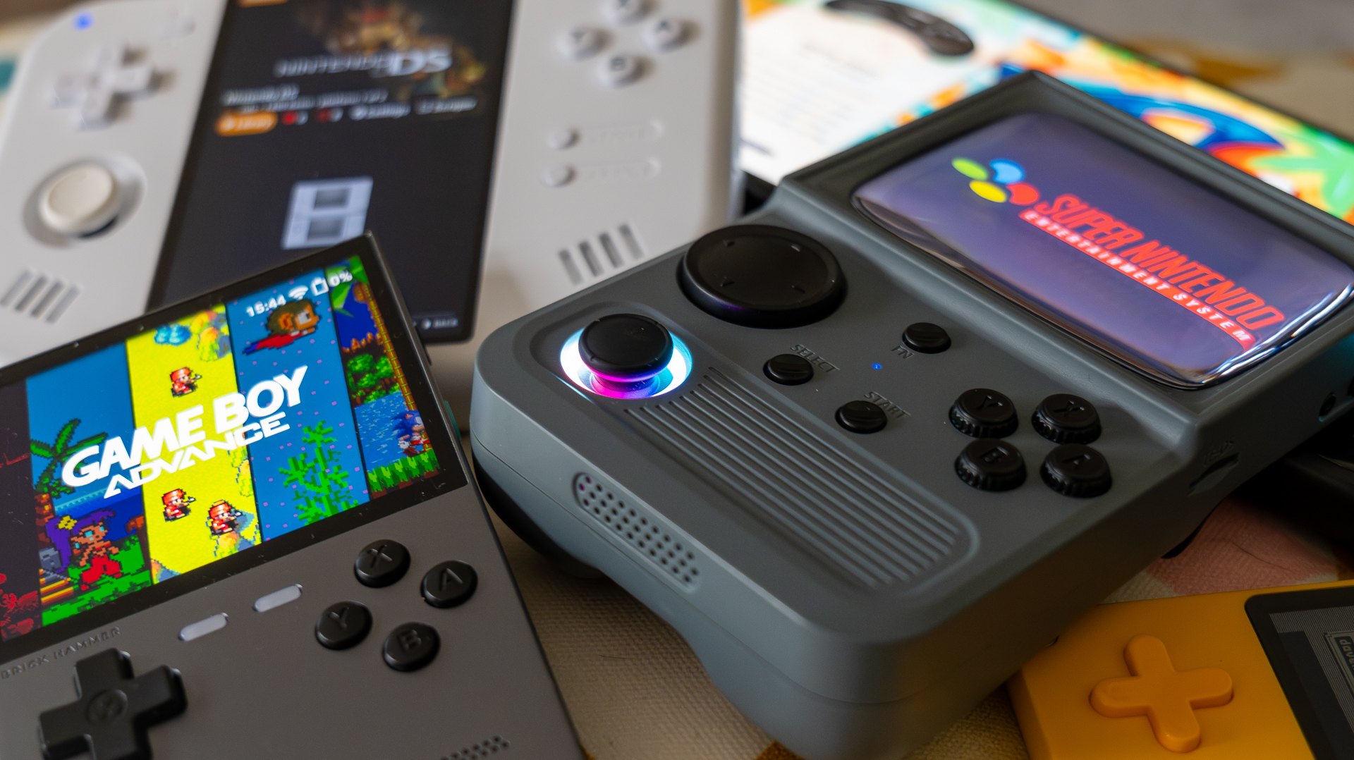 Retro gaming handhelds in a pile