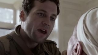 Webster yelling at a man in a white cap in Band of Brothers