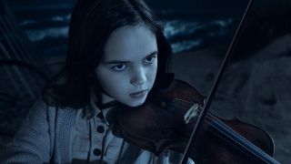 ryan kiera armstrong's alma playing violin in american horror story double feature