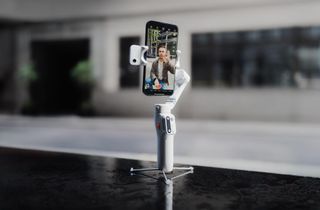 The Hohem iSteady V3 in white serves as an iPhone tripod for video calling.