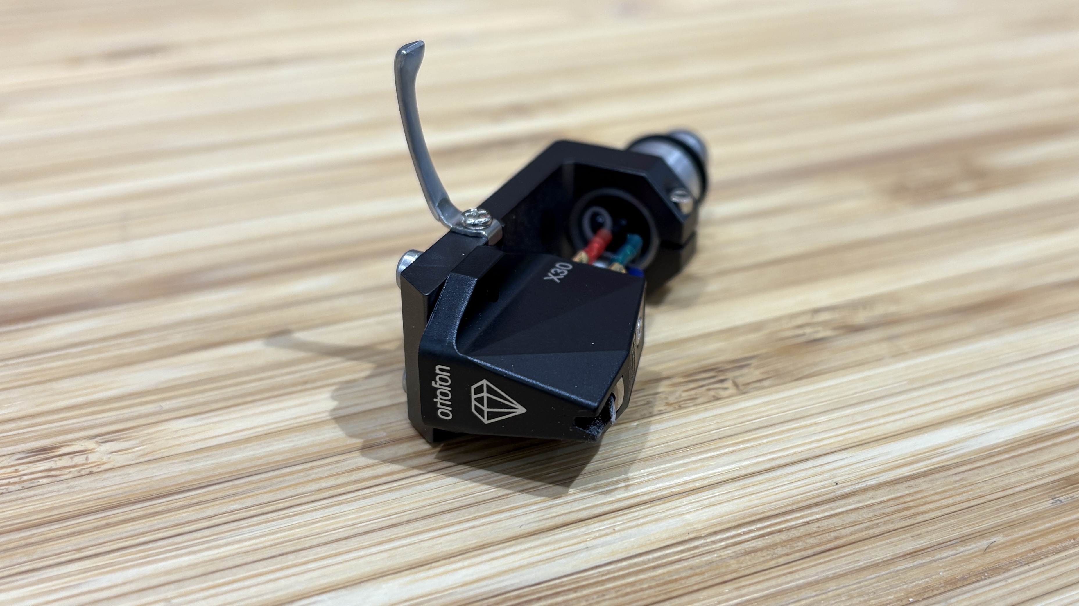 Ortofon MC X30 cartridge on a wooden rack