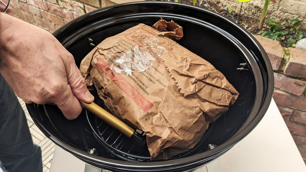 Napoleon NK14 Portable Charcoal Kettle Grill being tested in writer's home