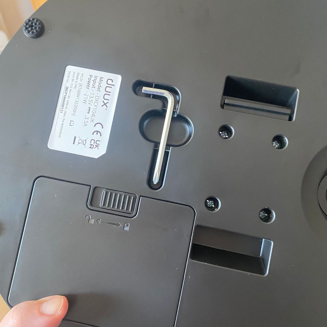 Underside of the base of the Duux Whisper Flex 2 showing the included allen key