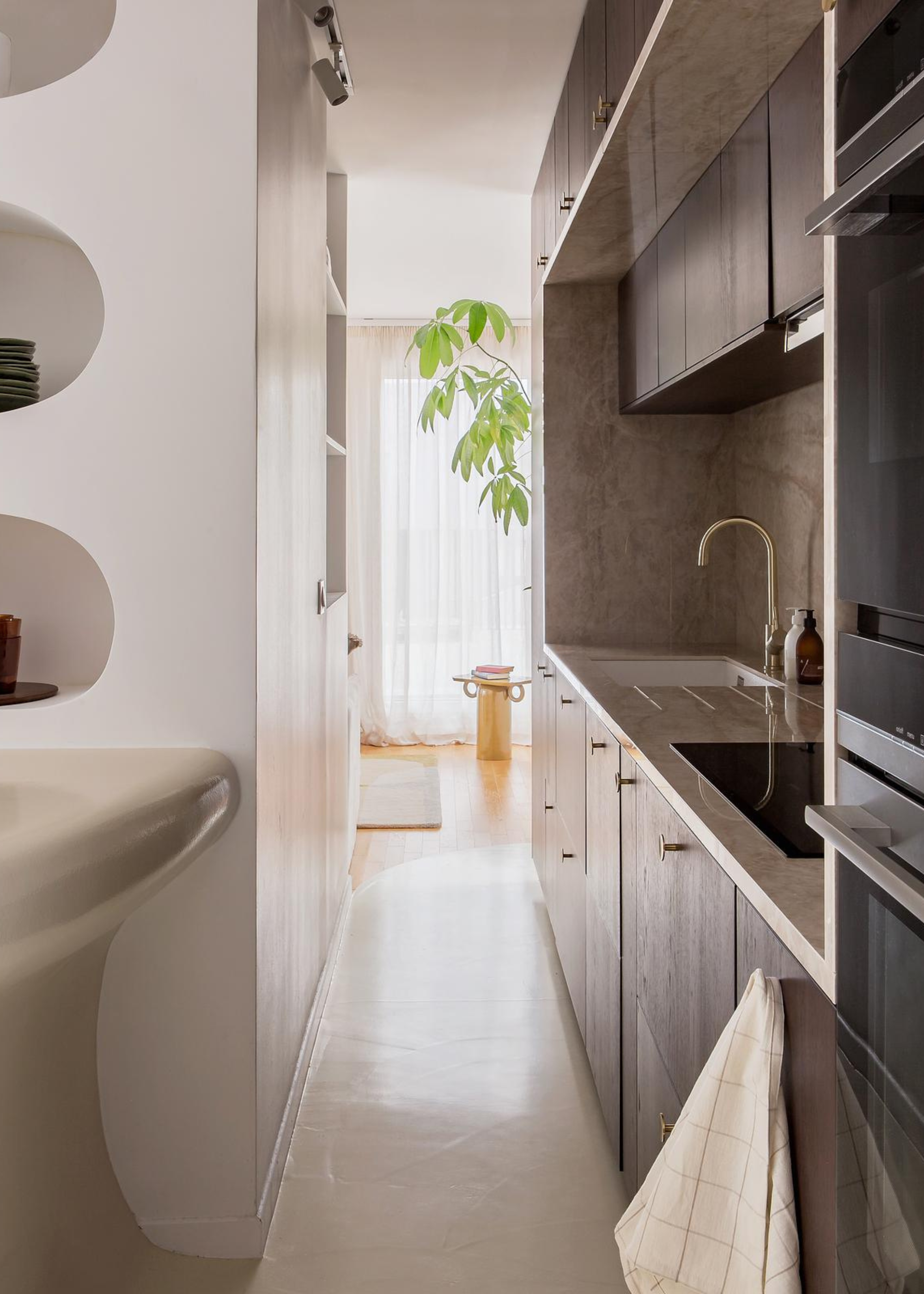 A small kitchen with wooden cabinetry