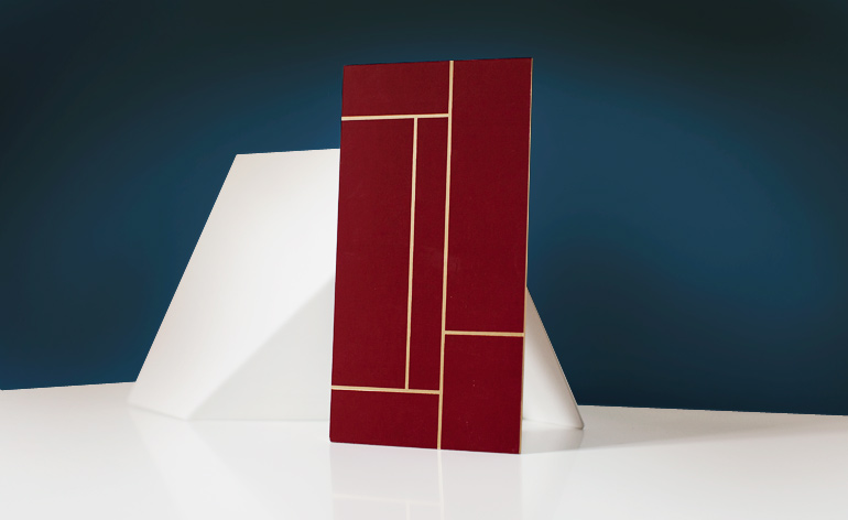 A UV-varnished card with gold foil edging