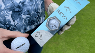 Callaway Reva Golf Ball and its stunning packaging held aloft on the golf course