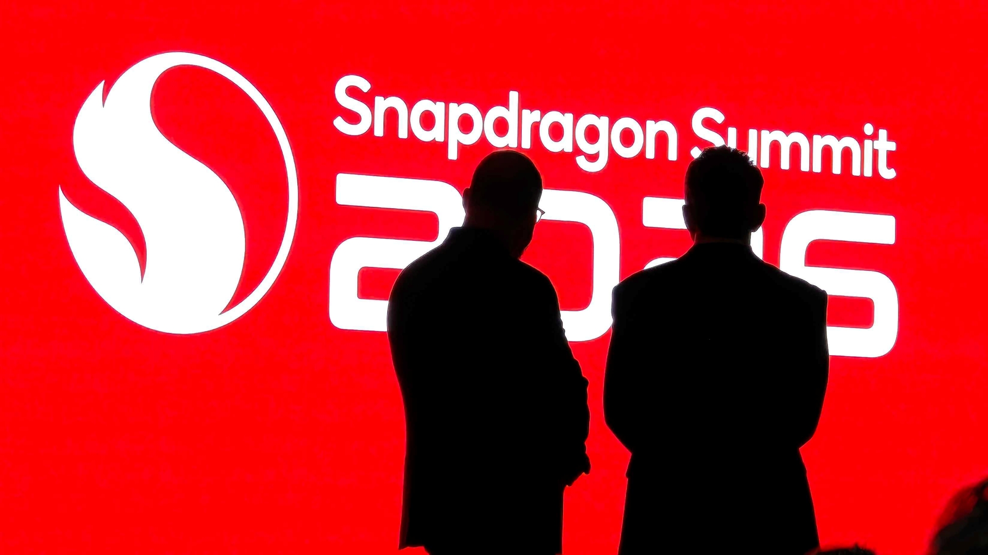 Cristiano Amon and another man in front of a Snapdragon Summit 2026 graphic