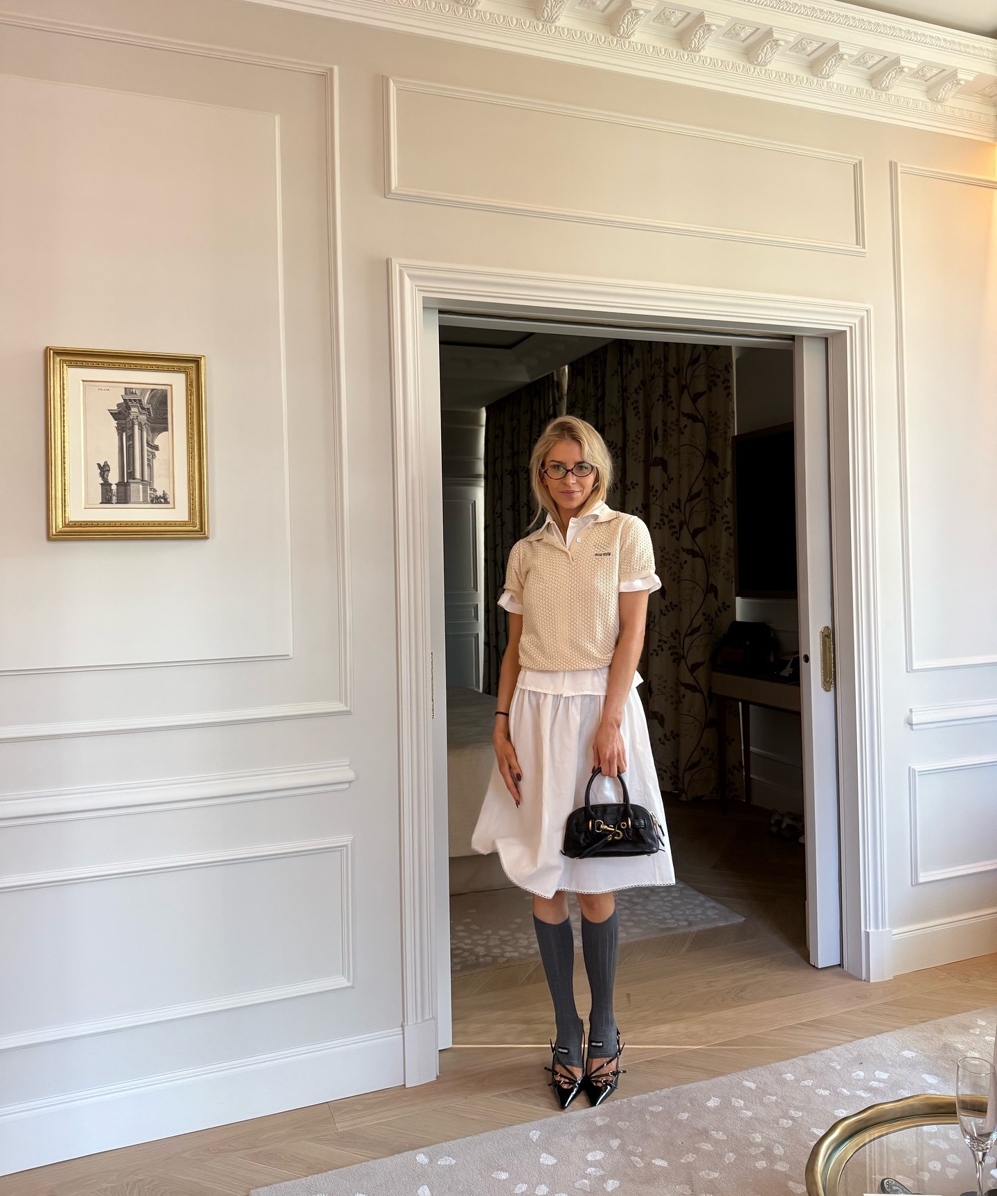 Influencer Caro Daur wearing a Miu Miu outfit with knee socks