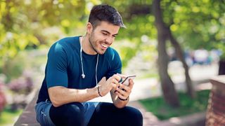 Man checking smartphone after run