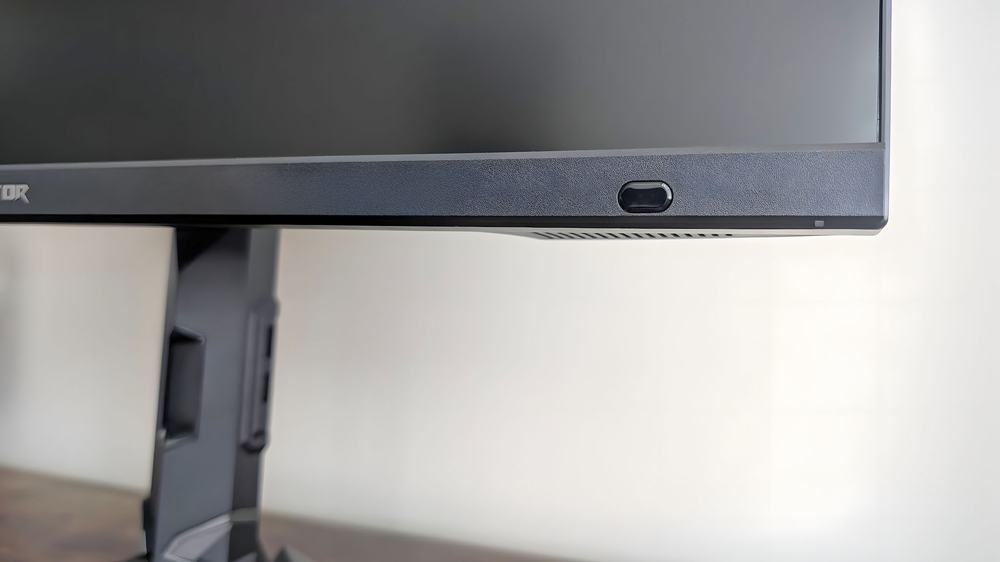 A closeup of the sensor on bottom right corner of the Acer Predator XB273K.