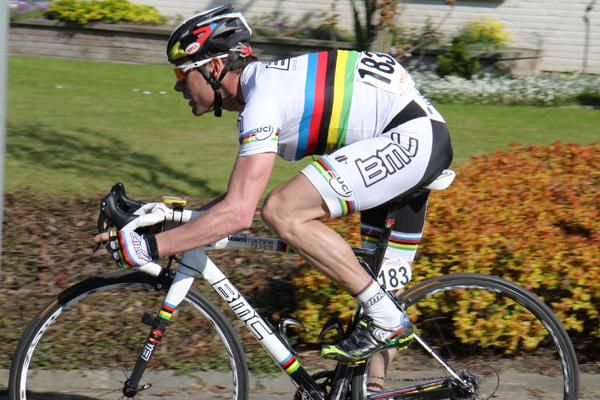 Cadel Evans (BMC Racing Team) shows off the world champion's colours as he rides for his team-mate.