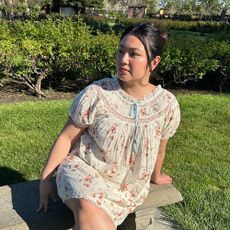 a woman wearing a babydoll dress