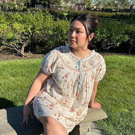 a woman wearing a babydoll dress
