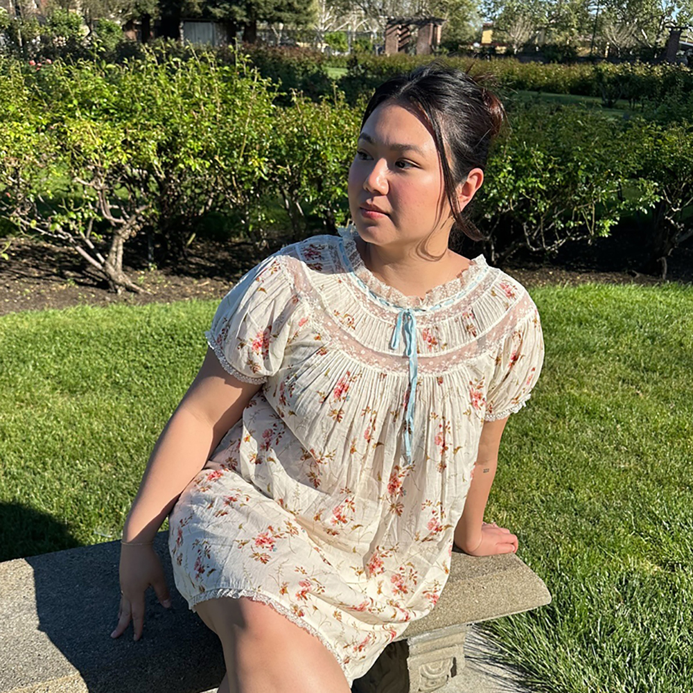 a woman wearing a babydoll dress