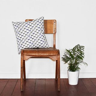 wooden chair with whale print cushion