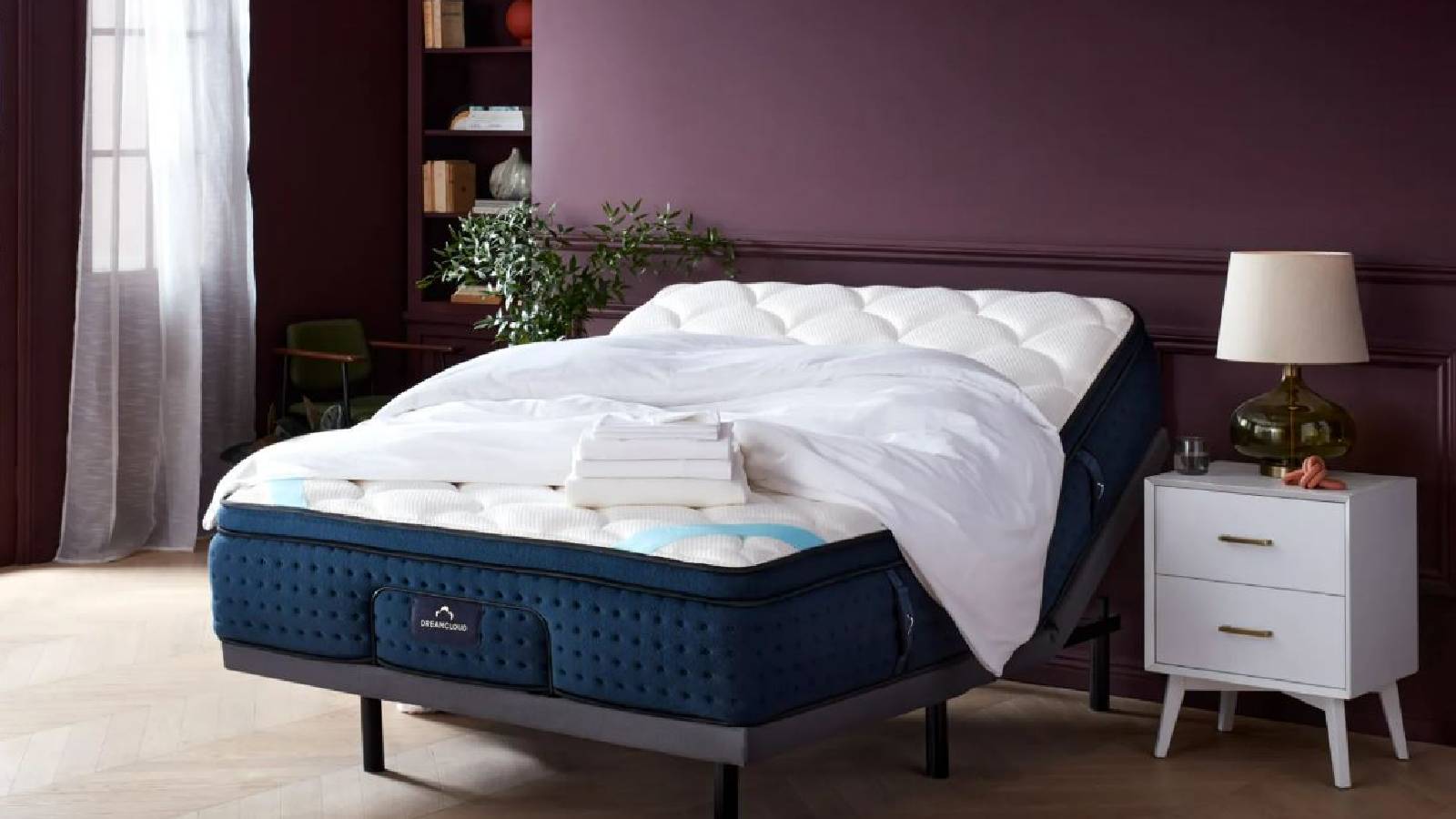 A DreamCloud mattress, bed frame and bed sheets