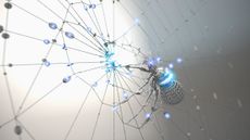 Robotic spider glowing with blue light on its web