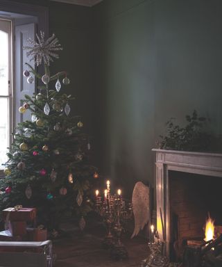 Christmas tree by fireplace