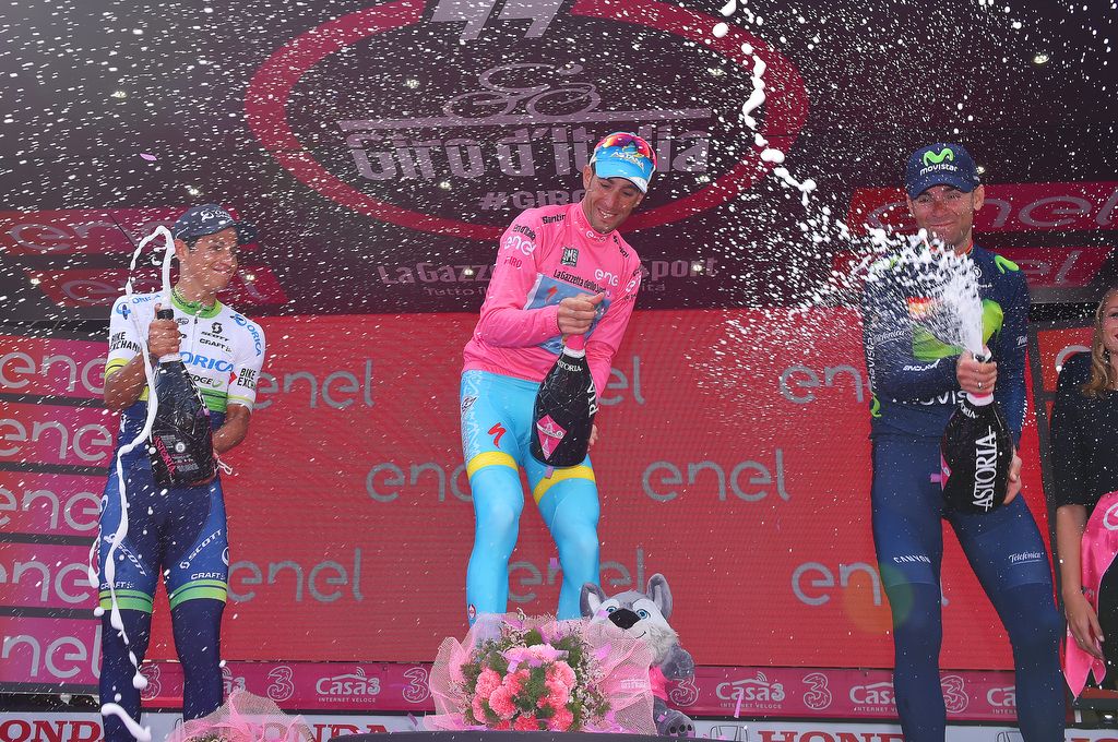 Esteban Chaves sprays the Prosecco on the podium
