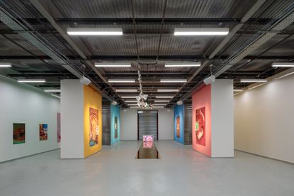 The interior of Elephant West with photographic works by Maisie Cousins