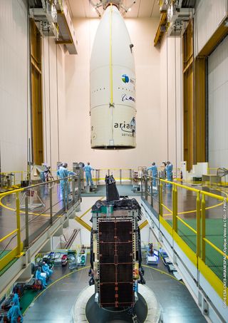 The payload fairing is ready to be positioned over Intelsat 29e, which is integrated atop its Ariane 5 launcher.