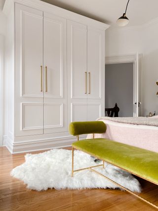 white millwork in a bedroom with a green daybed