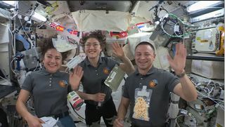 NASA astronauts Jessica Meir (left), Christina Koch (center) and Andrew Morgan will celebrate a "Friendsgiving" in space for the U.S. Thanksgiving holiday on the International Space Station this Nov. 28, 2019.