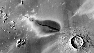 A satellite image of a recent explosive volcanic deposit around a fissure of the Cerberus Fossae system on Mars.