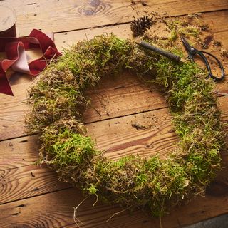 Christmas wreath frame wrapped in moss