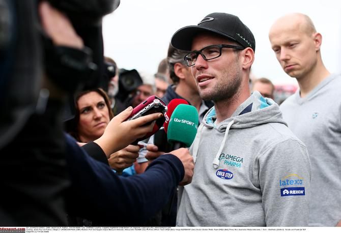 Mark Cavendish says goodbye to the 2014 Tour de France before the start of stage 2 after separating his shoulder