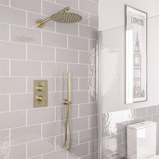 Tiled shower with brushed brass hardware