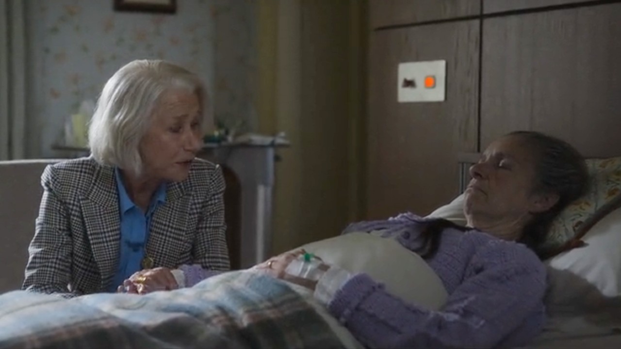 Helen Mirren looking over Susan Kirby in The Thursday Murder Club.