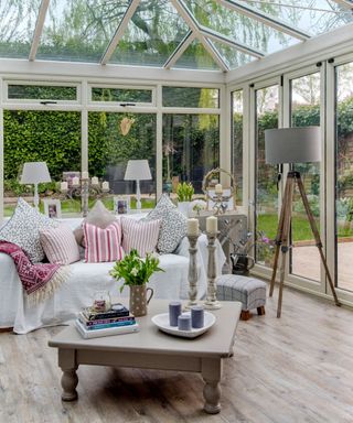 conservatory with white sofa and table