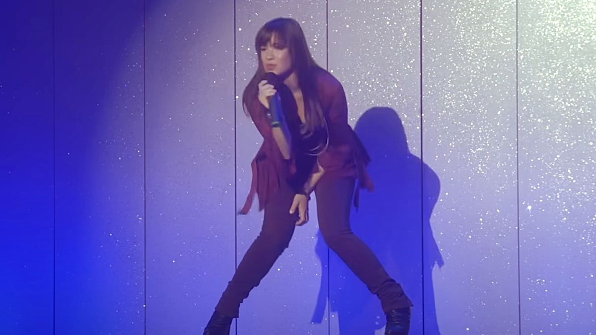 Demi Lovato bending knees singing in music video for Camp Rock&#039;s This Is Me