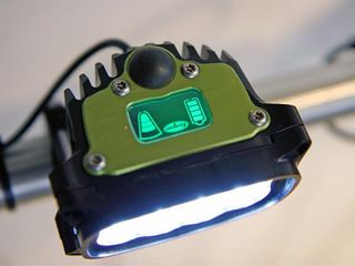 The on-board display on the new Hope Vision R8 light shows the current light output, the selected mode, and remaining battery life