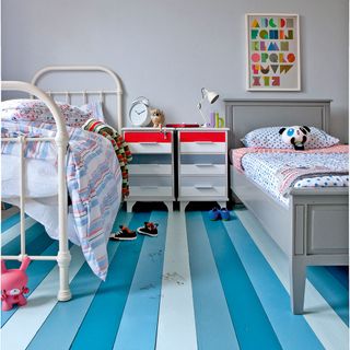 children's bedroom with grey walls and two single beds