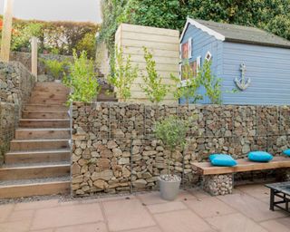 tiered garden with stone filled gabion retaining walls