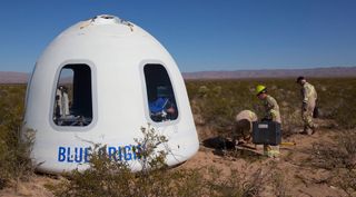The crew capsule from Blue Origin's New Shepard vehicle after landing Dec. 12 on a suborbital test flight. The capsule carried experiments as well as a test dummy to collect data on what people will experience on future flights.