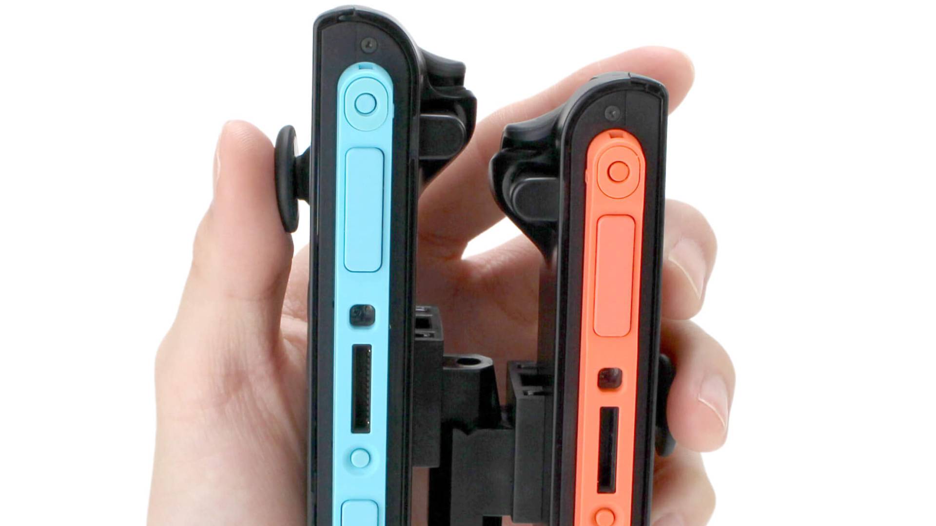 Official product image of someone holding the Game Tech one-handed grip with one hand.