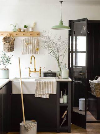laundry room storage ideas combined storage with wall hooks by Garden Trading