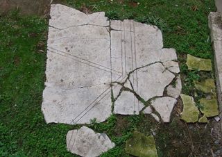A fragment of white marble paving found at Hagia Sophia is decorated with a hexagon or octagon within a rectangle.